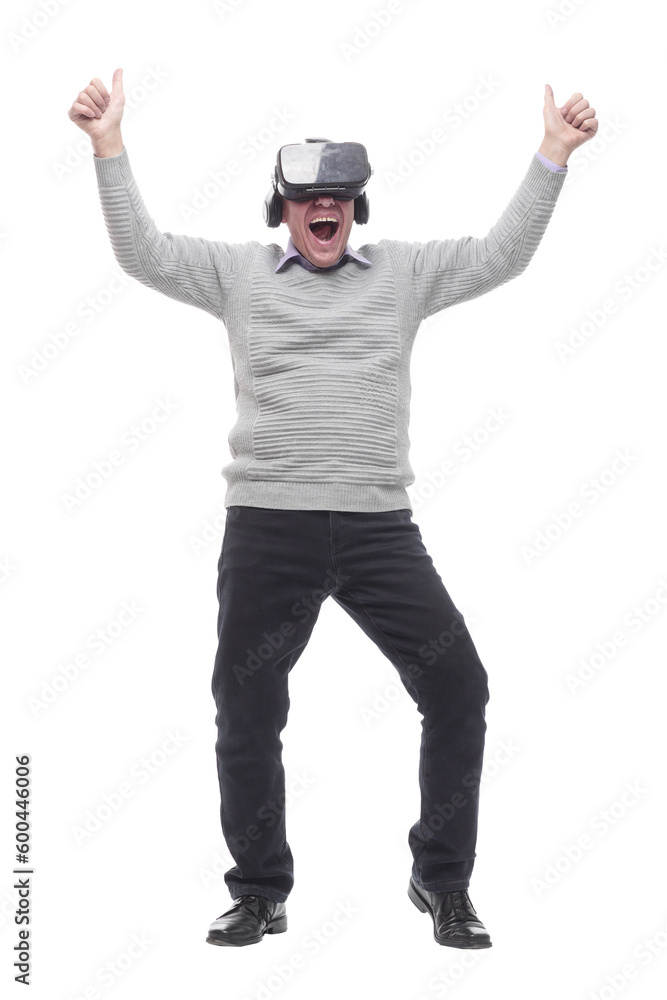 in full growth. smiling man in virtual reality glasses. in full growth. smiling man in virtual reality glasses.