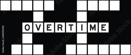 Alphabet letter in word overtime on crossword puzzle background
