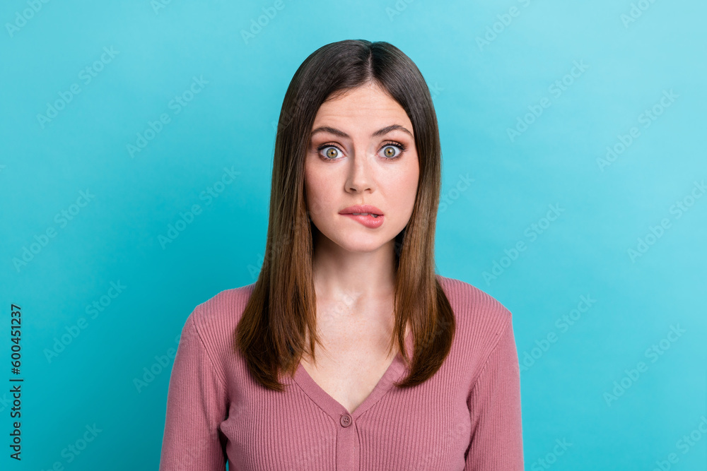 Photo of astonished impressed girl with straight hairdo dressed pink cardigan staring biting lip isolated on blue color background Photo of astonished impressed girl with straight hairdo dressed pink cardigan staring biting lip isolated on blue color background