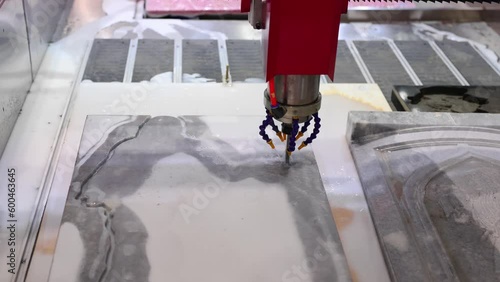 Laser automatic engraving of marble boards.