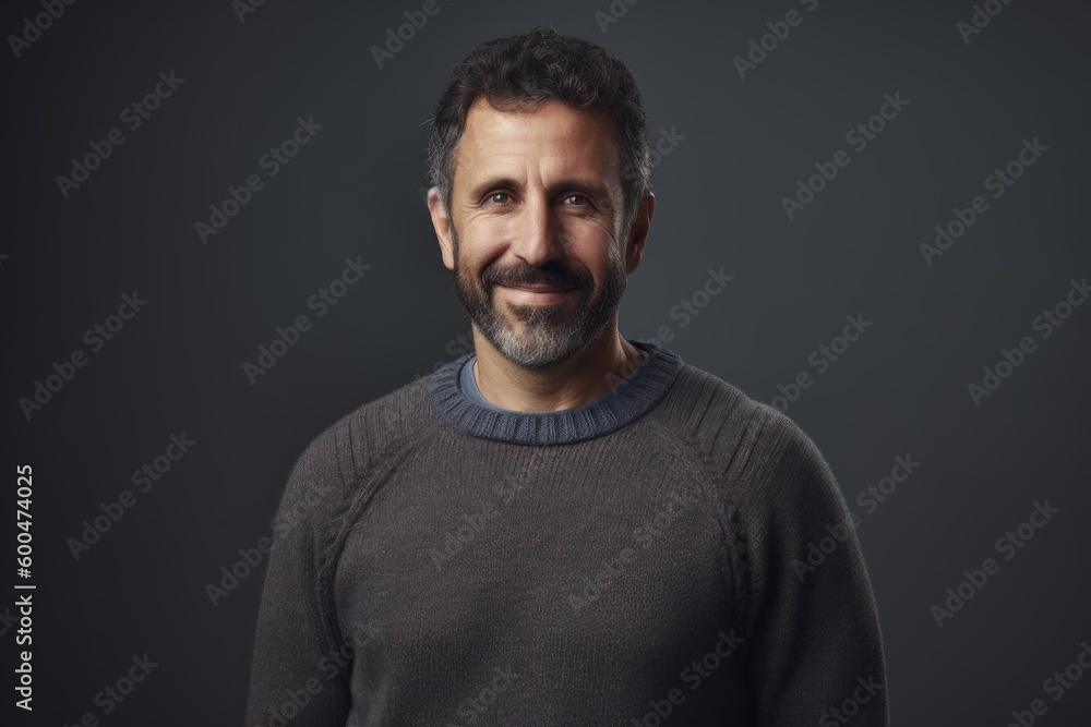 Portrait of a handsome man with a beard on a dark background