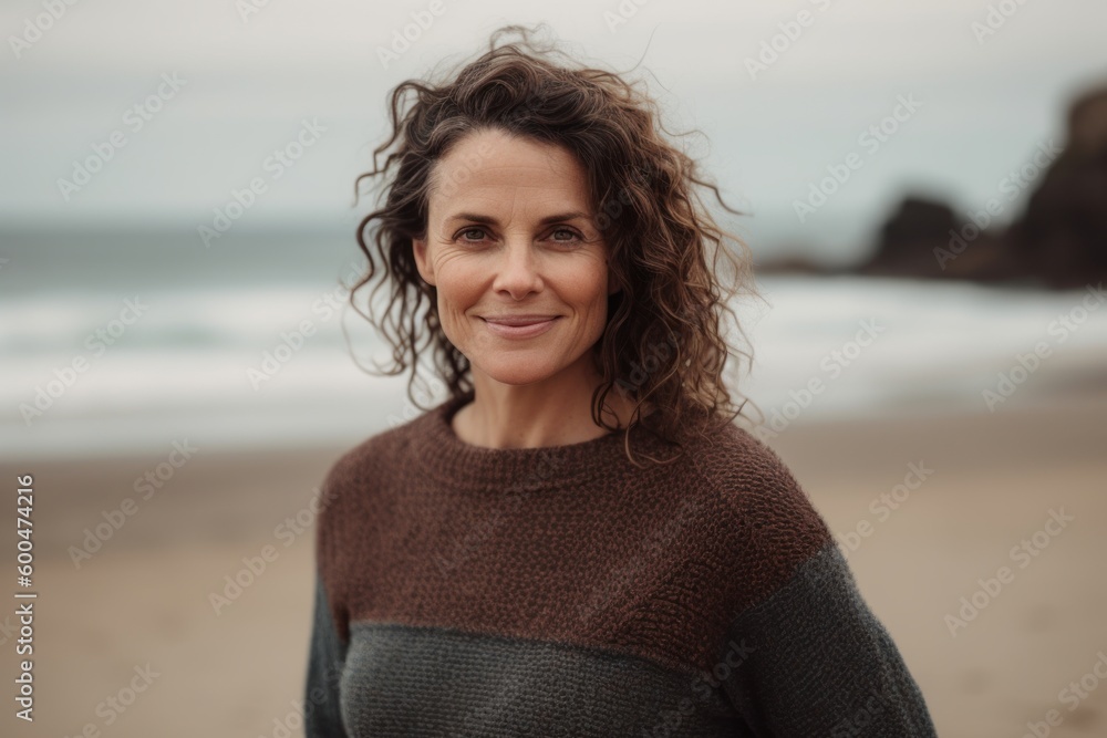Full-length portrait photography of a grinning woman in her 40s wearing a cozy sweater against a beach background. Generative AI Full-length portrait photography of a grinning woman in her 40s wearing a cozy sweater against a beach background. Generative AI