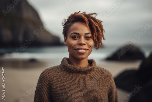 Portrait of smiling african american woman at the beach.