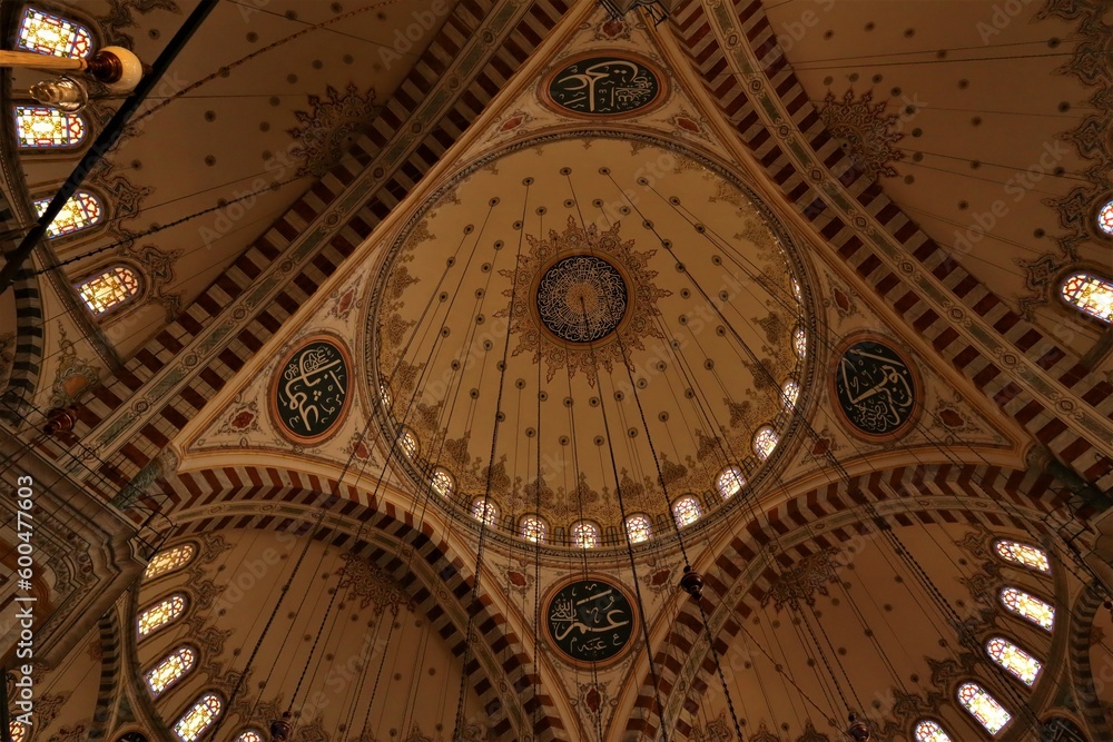 Naklejka premium Istanbul, Turkey. 04.29.2023 View from inside the dome of Fatih Mosque (Conqueror's Mosque). Public Ottoman mosque in the Fatih district of Istanbul, Turkey, with a huge decorated domes