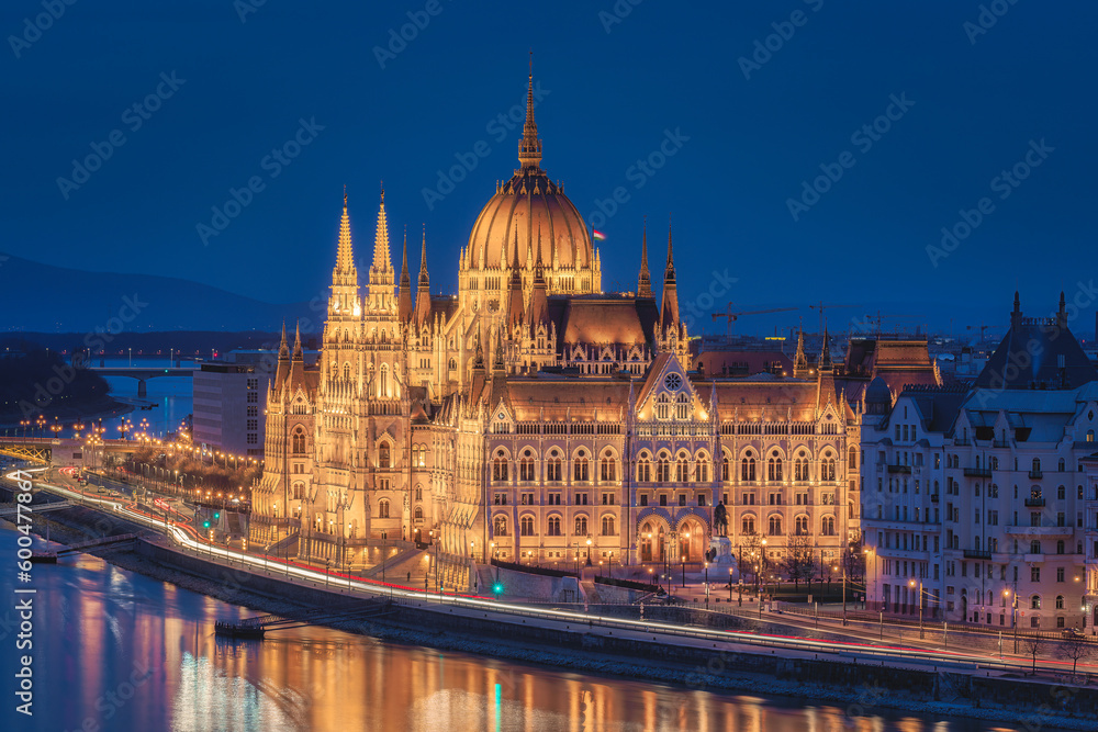 Budapest parliament illuminated at night.