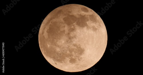 Penumbral Lunar Eclipse May Flower Moon. Super Full Moon with Dark Background photo