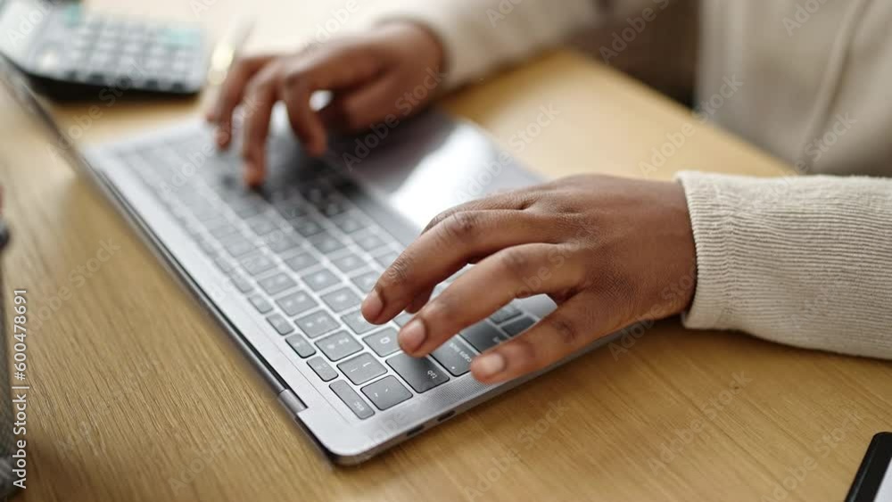 African american woman using laptop at office African american woman using laptop at office