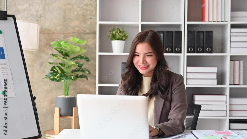 Smiling professional financial consultant chatting with client online, giving internet consultation to customer via laptop computer