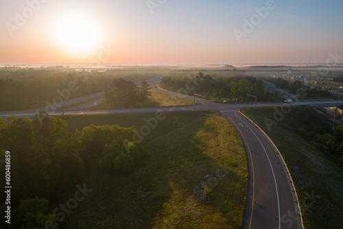 sunset over the city and road