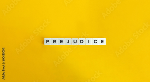 Prejudice Word on Letter Tiles on Yellow Background. Minimal Aesthetics.