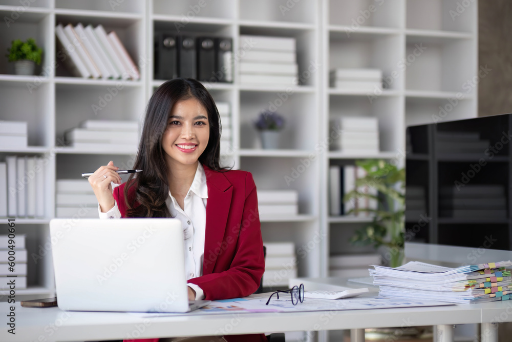 Business woman using calculator for do math finance on wooden desk in office and business working background, tax, accounting, statistics and analytic research concept.. Business woman using calculator for do math finance on wooden desk in office and business working background, tax, accounting, statistics and analytic research concept..