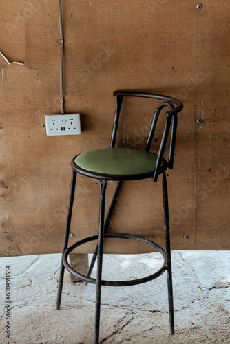 Konstfotografi Chair next to electrical utility plug in box, found in Uganda Africa