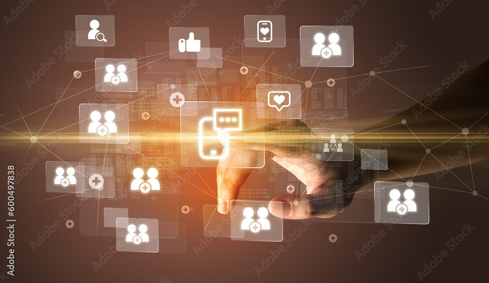 Hand pressing social media multimedia application screen with media icons on futuristic concept Hand pressing social media multimedia application screen with media icons on futuristic concept
