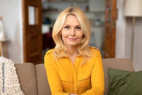 Fotografie Portrait Of European Lady Posing Expressing Positive Emotions At Home
