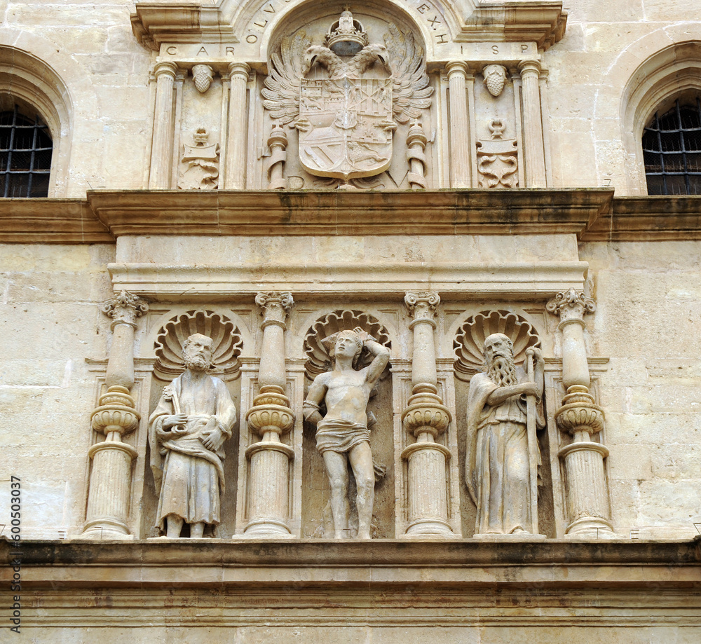 Sculptures of Saint Peter and Saint Paul with Saint Sebastian in the center. Plateresque doorway of the parish church of Saint Sebastian in Antequera, Malaga province, Andalusia, Spain