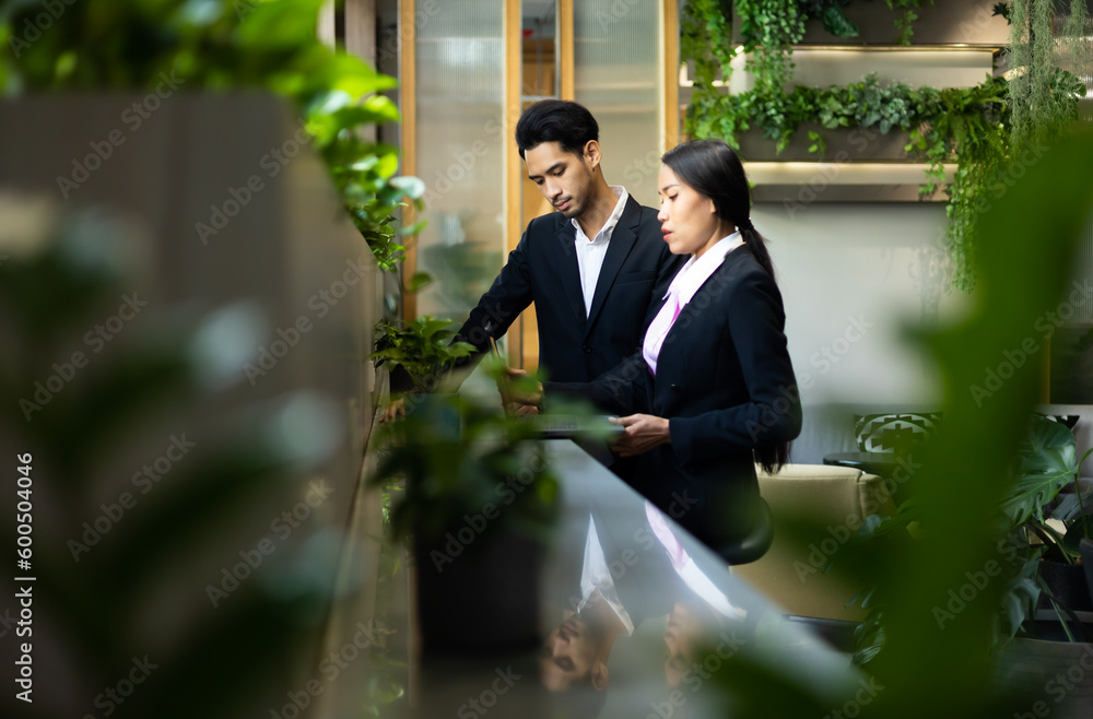 Business people using laptop computer in modern office coworking space. Entrepreneurs working together in workspace Business people using laptop computer in modern office coworking space. Entrepreneurs working together in workspace