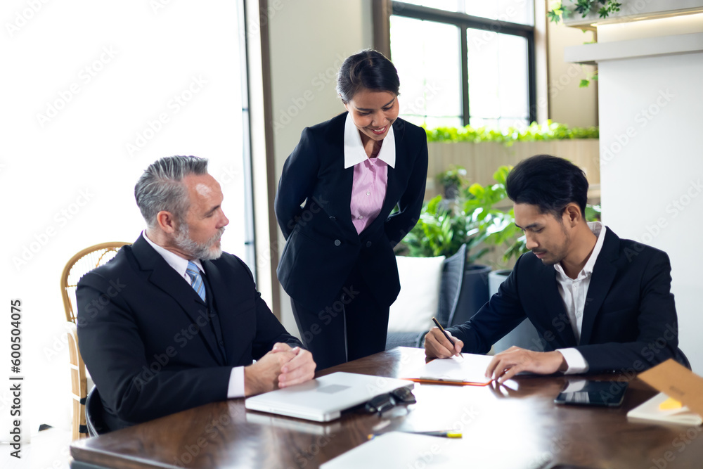 Business contract and agreement concept. Senior business man and young business asian man signing contract for investment or buy estate and insurance Business contract and agreement concept. Senior business man and young business asian man signing contract for investment or buy estate and insurance