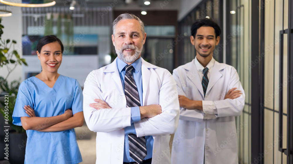 Portrait Diverse doctor and nurse walking and talking together at hospital medical wellness center. Professional medical staff people successful and teamwork concept Portrait Diverse doctor and nurse walking and talking together at hospital medical wellness center. Professional medical staff people successful and teamwork concept