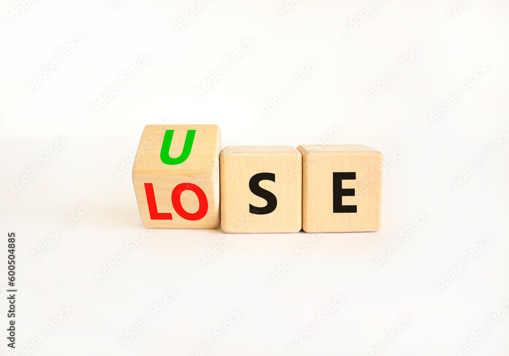 Use or lose symbol. Concept words Use or lose on wooden cubes. Businessman hand. Beautiful white table white background. Business Use or lose concept. Copy space. Use or lose symbol. Concept words Use or lose on wooden cubes. Businessman hand. Beautiful white table white background. Business Use or lose concept. Copy space.