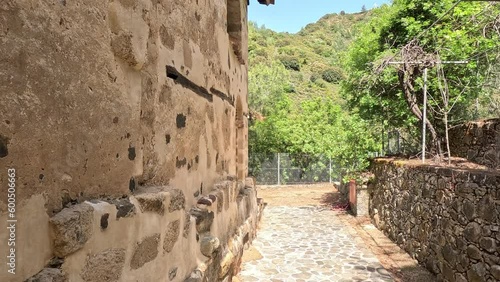 Walking along old anthient wall building in the mountains, summer time and great wheather. 