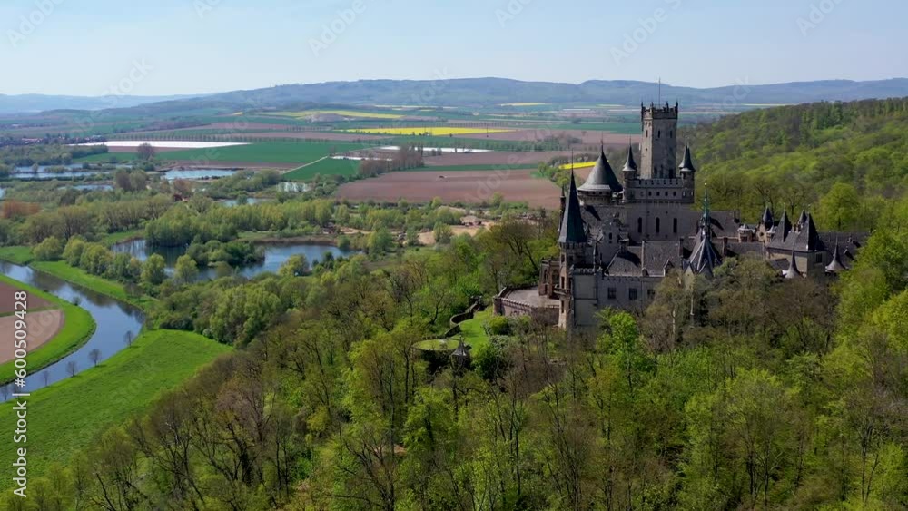 Aerial drone view medieval gothic castle Marienburg, Lower Saxony, Germany near Hanover in sunny spring day. High quality 4k footage Aerial drone view medieval gothic castle Marienburg, Lower Saxony, Germany near Hanover in sunny spring day. High quality 4k footage
