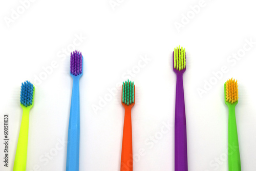 set of multicolored toothbrushes on white