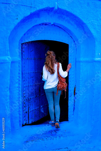 tourism in Morocco-Woman tourist in beautiful blue street in Chefchaouen © M.studio