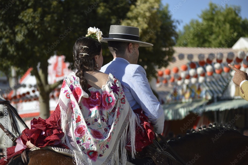 Obraz premium A couple dressed with the typical costumes of the world famous 'Feria de abril' of Seville, Spain 