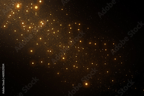 Gold sparkles and glitter on black background. Abstract defocused lights and bokeh on dark background