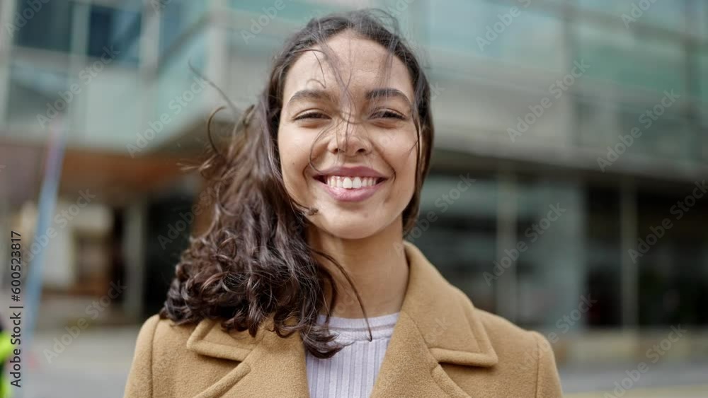 Young beautiful hispanic woman smiling confident at street Stock Video ...
