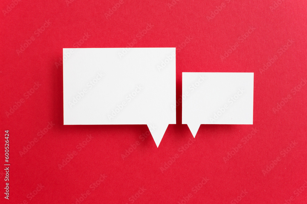 paper speech bubble on red background paper speech bubble on red background