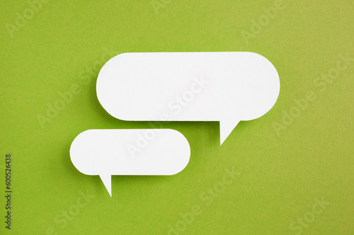 paper speech bubble on green background