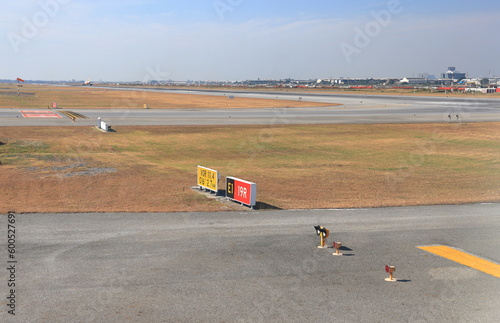 sign markings on taxiway for direction at airport photo