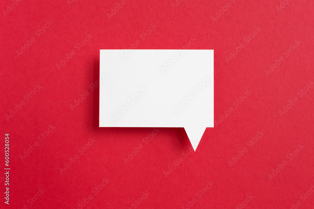paper speech bubble on red background paper speech bubble on red background