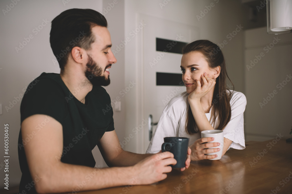 Positive young couple spending time together at home Positive young couple spending time together at home