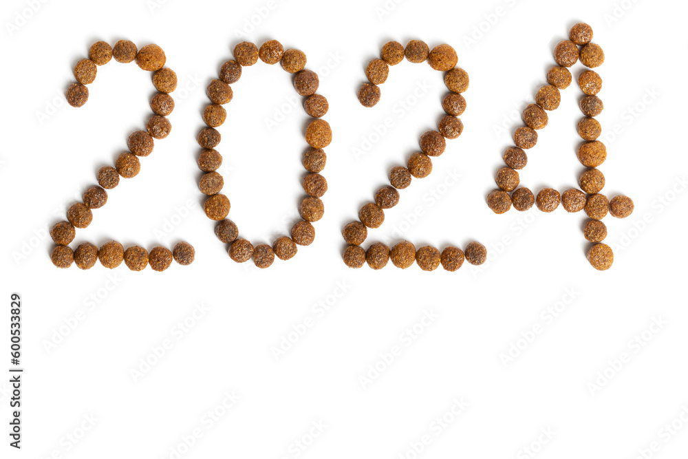 Calendar 2024 from Dry pet food on a white background. Granules of good nutrition for dogs and cats Calendar 2024 from Dry pet food on a white background. Granules of good nutrition for dogs and cats