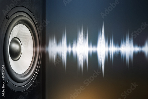 audio speaker and sound wave on dark background