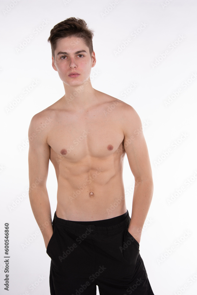 Young attractive guy posing in the studio.	