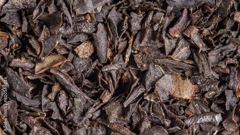 Tea black, small chopped dried leaves brown, rotating, turning, close-up macro
Tea black, small chopped dried leaves brown, rotating, turning, close-up macro