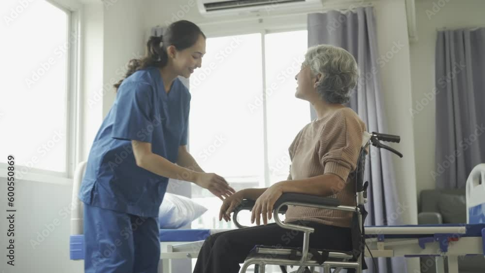 A happy elderly patient with a friendly female caregiver Caring and encouraging patients Old woman at the hospital. Her. Healthcare and medical concept. A happy elderly patient with a friendly female caregiver Caring and encouraging patients Old woman at the hospital. Her. Healthcare and medical concept.