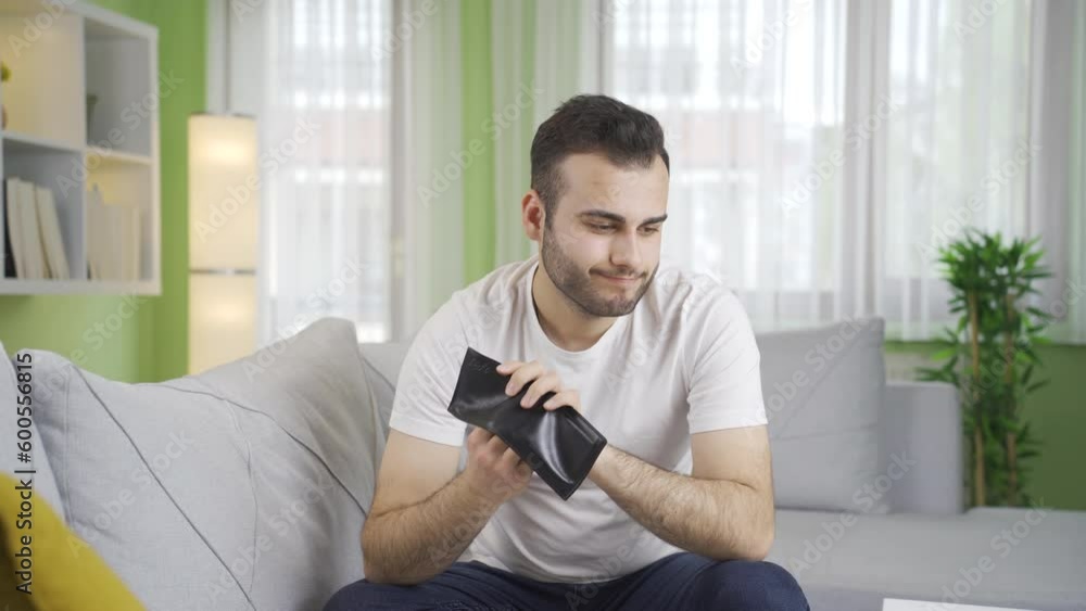 Depressed young man suffering financial loss. Depressed young man suffering financial loss.