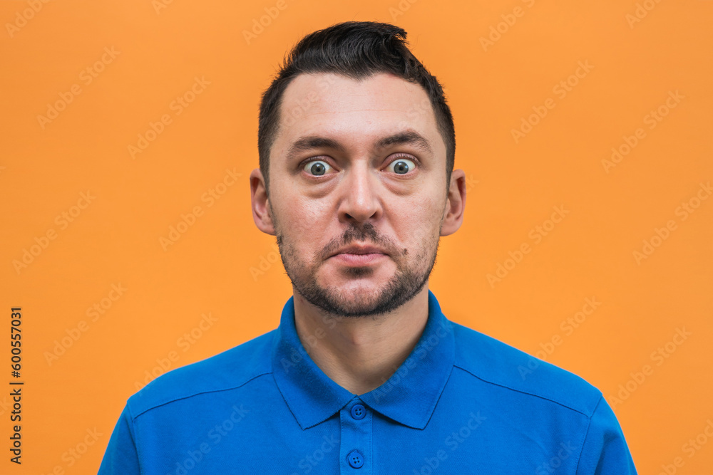 Portrait of the man on orange background. Man's emotions Portrait of the man on orange background. Man's emotions