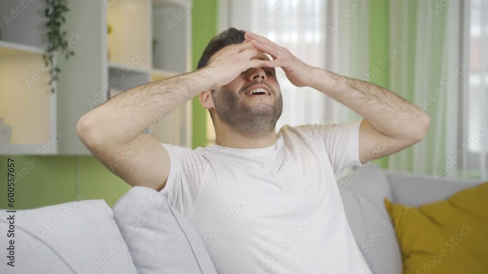 Man relaxing and resting on sofa at home. Man relaxing and resting on sofa at home.