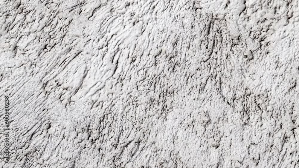 Plaster gray, rough uneven streaks, rotating, turning, close-up, macro
Plaster gray, rough uneven streaks, rotating, turning, close-up, macro