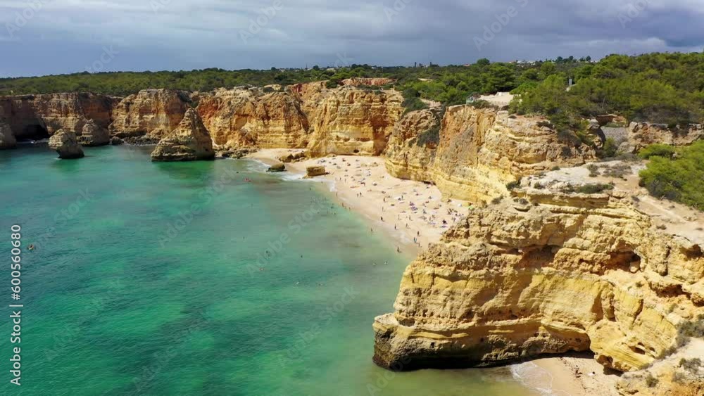 Praia da Marinha, beautiful beach Marinha in Algarve, Portugal. Navy Beach (Praia da Marinha) with flying seagulls over the beach, located on the Atlantic coast in Lagoa Municipality, Algarve. Praia da Marinha, beautiful beach Marinha in Algarve, Portugal. Navy Beach (Praia da Marinha) with flying seagulls over the beach, located on the Atlantic coast in Lagoa Municipality, Algarve.