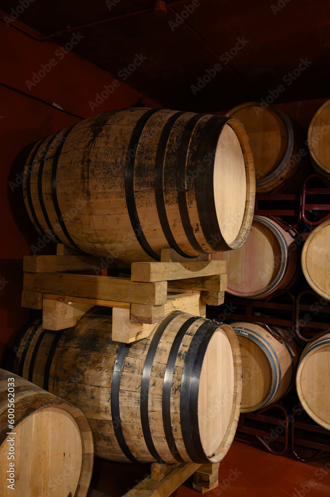 Production of fortified jerez, xeres, sherry wines in dark oak barrels in sherry triangle, Jerez la Frontera, El Puerto Santa Maria and Sanlucar Barrameda Andalusia, Spain