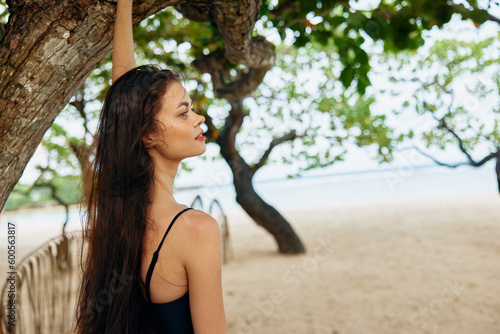 Canvas Print woman sand young nature summer tropical smile ocean beach sea vacation