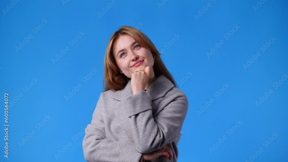 4k video of a girl thinking about something over blue background. 4k video of a girl thinking about something over blue background.