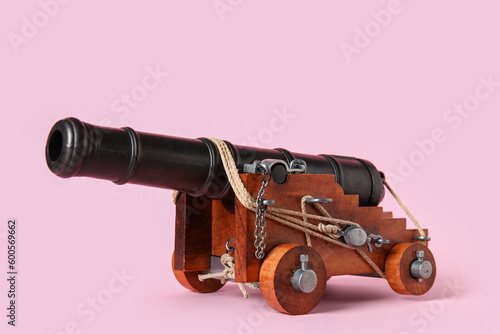 Toy model of cannon on pink background © Pixel-Shot