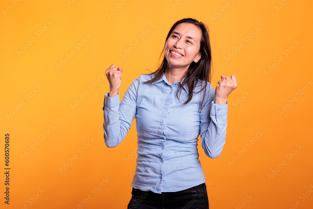 Cheerful model dancing and having fun during leisure time in studio over isolated background. Cheerful filipino woman enjoying showing her dance moves during break time. Entertainment concept Cheerful model dancing and having fun during leisure time in studio over isolated background. Cheerful filipino woman enjoying showing her dance moves during break time. Entertainment concept